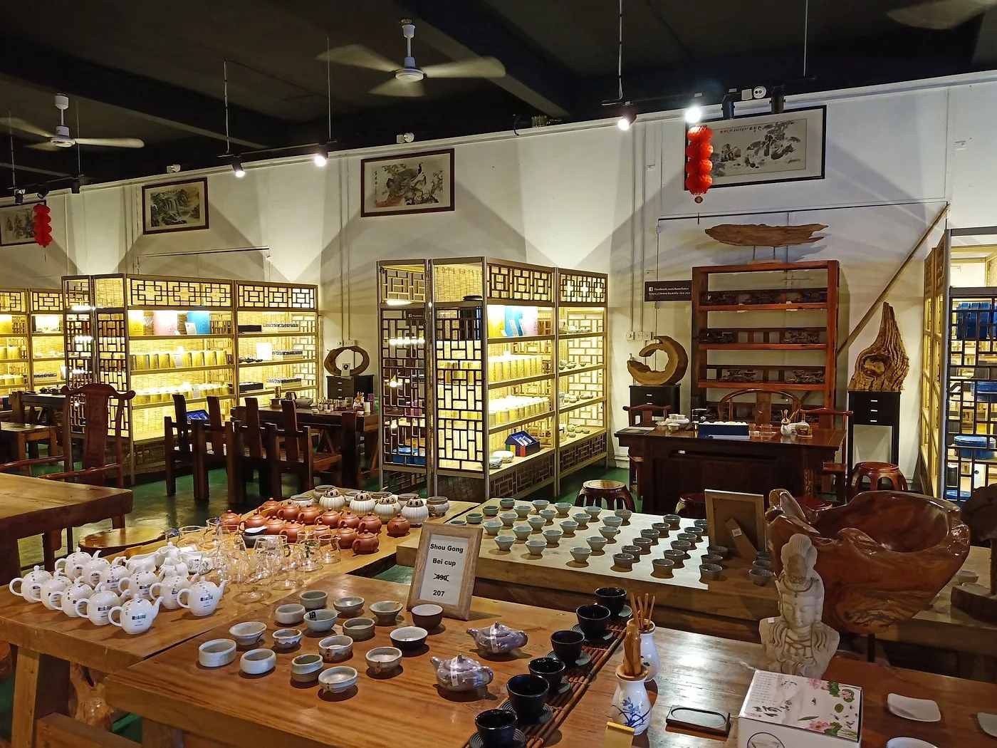 Tea cups, teapots and wooden displays in the Kuan Fu tea showroom in Mauritius