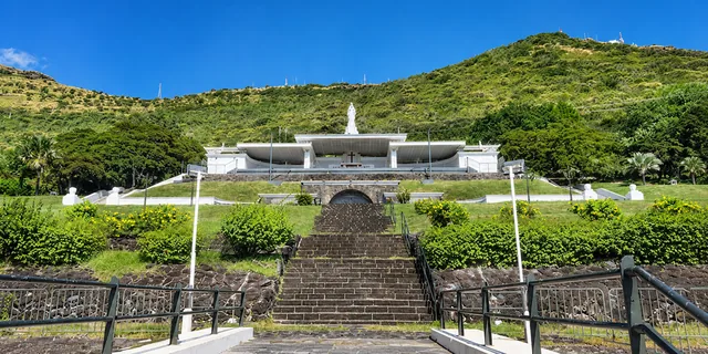 Steps and terraced gardens leading to Marie Reine de la Paix sanctuary in Port Louis